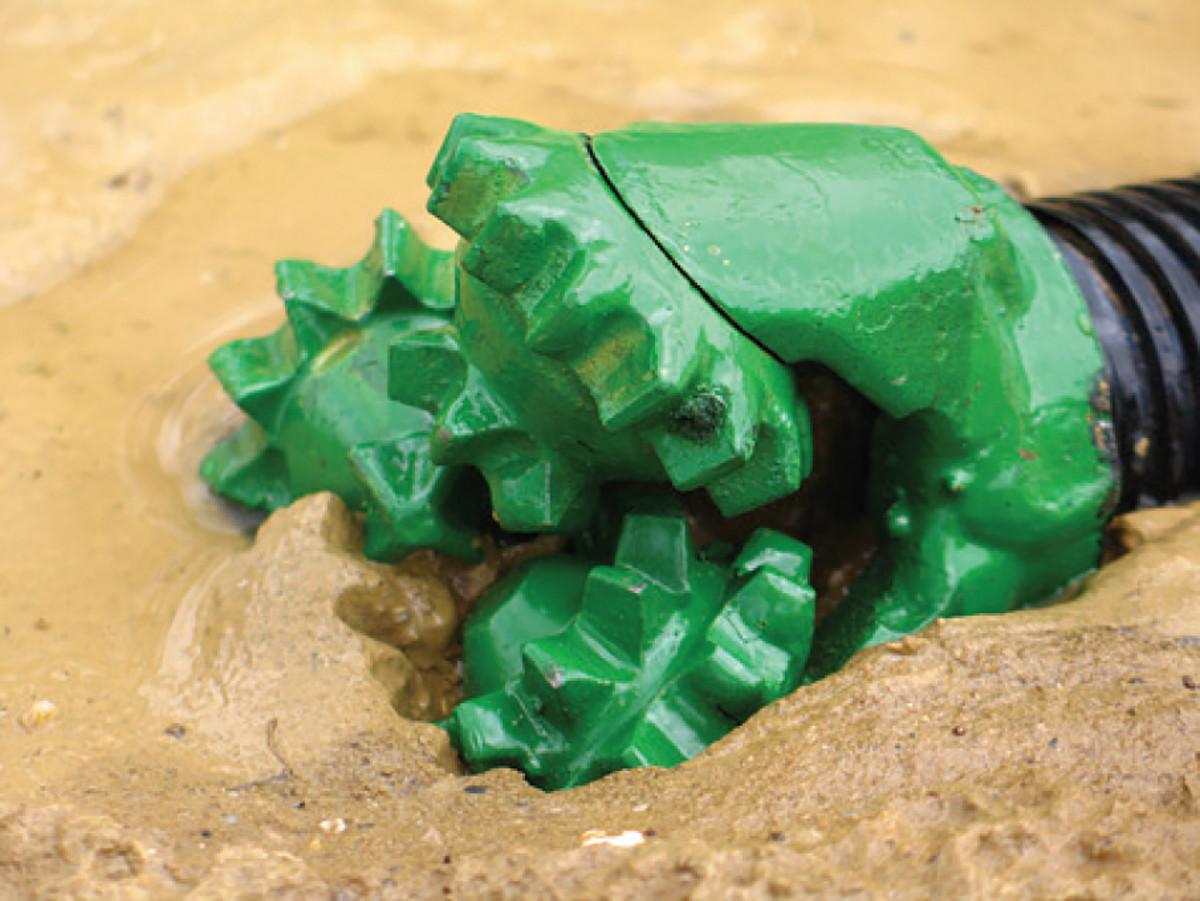 Drill bit in drilling fluid