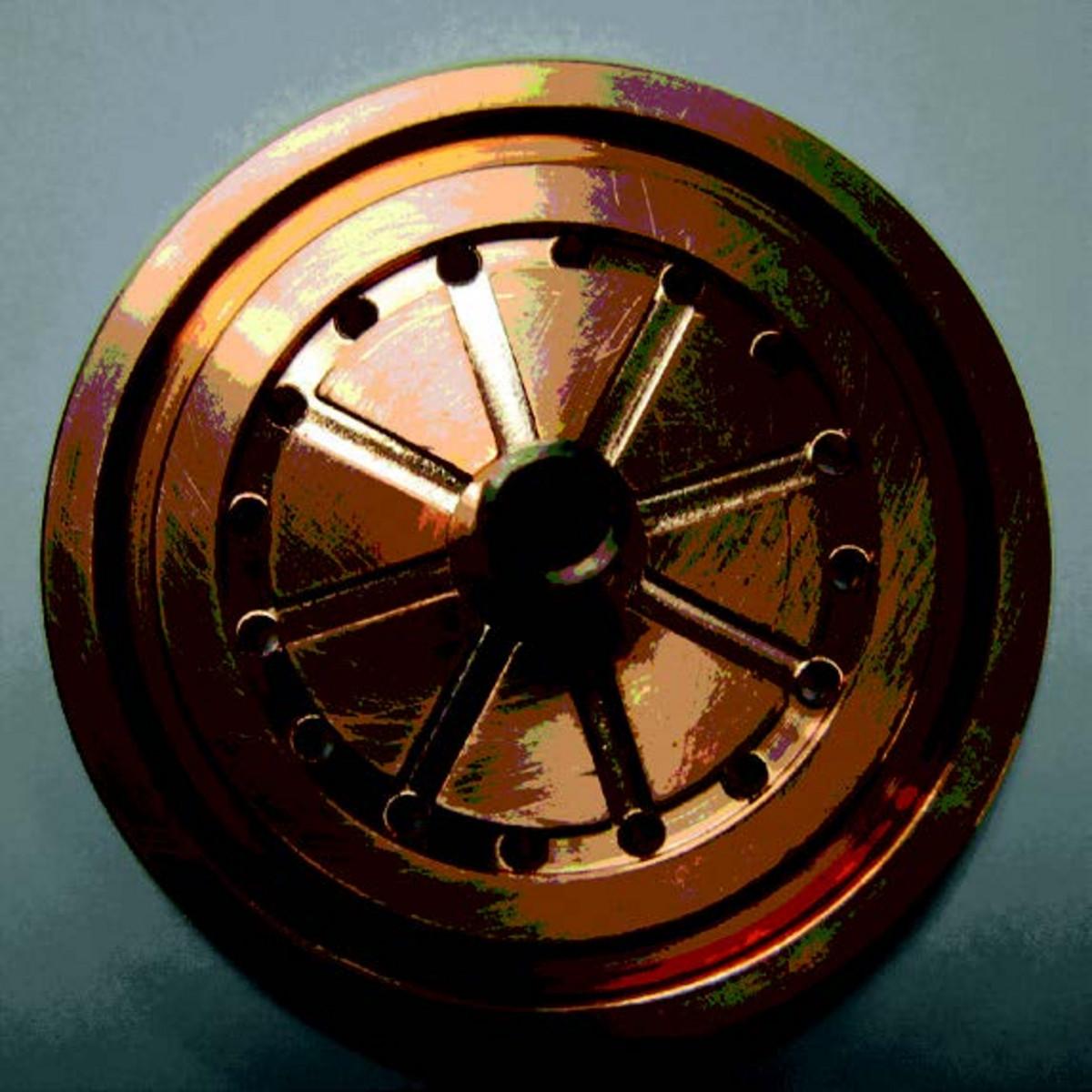 In GDOES, the 'anode' is the mainly positive electrode. The copper tube is the anode. It is electrically grounded.