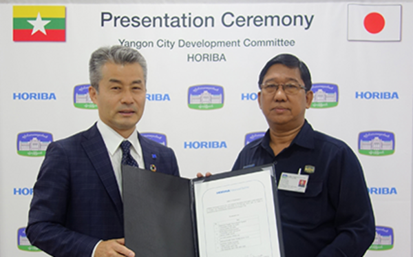 Koichiro Kanaya, Corporate Officer, HORIBA Advanced Techno (left), and Thein Min, Deputy Head, Water & Sanitation Department, YCDC Koichiro Kanaya, Corporate Officer, HORIBA Advanced Techno (left), and Thein Min, Deputy Head, Water & Sanitation Department, YCDC