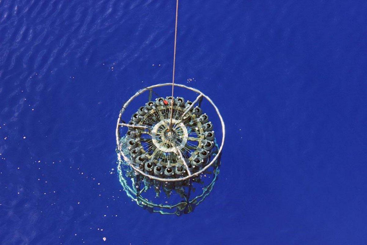 Figure 2. CTD-Rosette sampler being deployed in the ultra blue waters of the South Pacific Gyre in Dec 2015