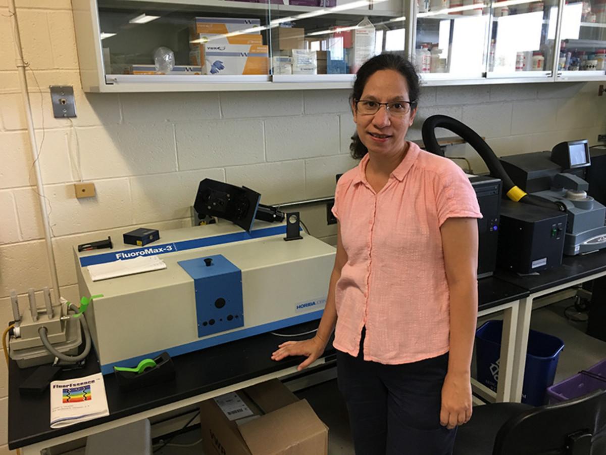 Doctoral candidate Karina Lewerissa with a HORIBA FluoroMax-3