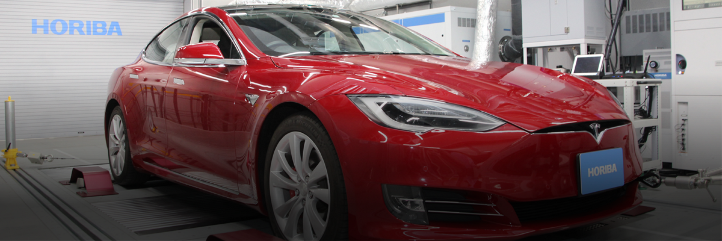 Tesla electric vehicle in a HORIBA test cell for battery durability testing | UN GTR No. 22