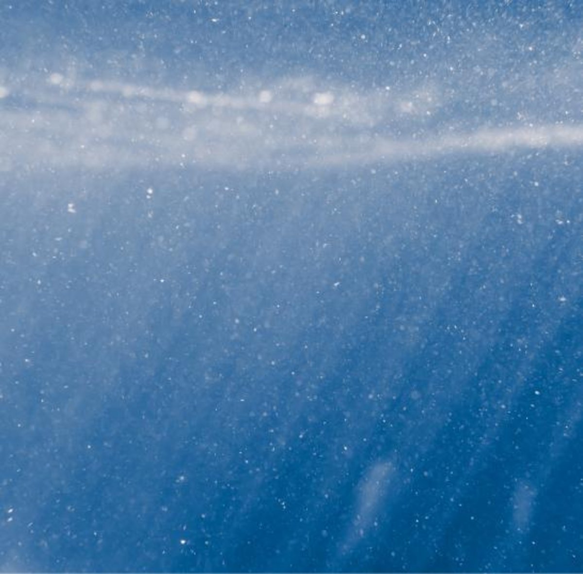 Close-up image of dirt particles underwater