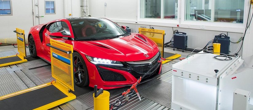 Light-duty vehicle undergoing chassis dynamometer testing as part of light-duty engine testing, emissions measurement, and certification validation.