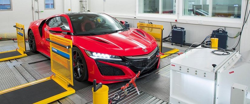 Light-duty vehicle undergoing chassis dynamometer testing as part of light-duty engine testing, emissions measurement, and certification validation.